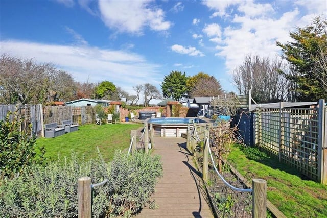 This detached seaside home has a pool, private annexe, studio and secret garden with clockhouse cabins - on the market for £850,000 with Cubitt & West on Zoopla.