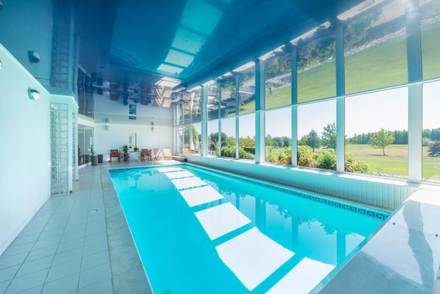 This former country club is now a seven-bedroom harbourside home with an indoor swimming pool, sauna and gym/squash court - on the market for £3,950,000 with Strutt & Parker on Zoopla.