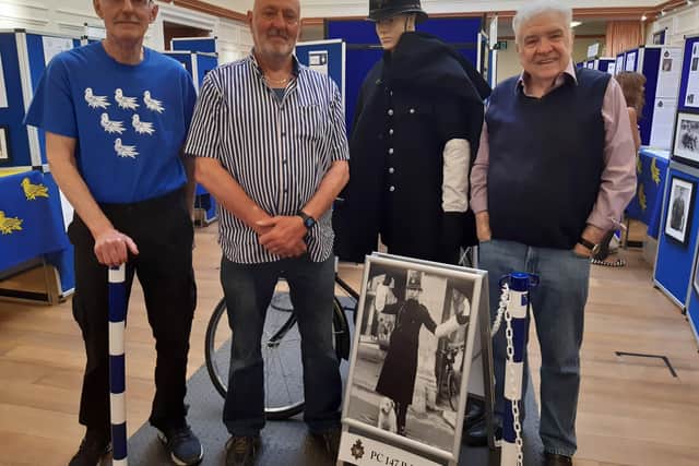 Brothers Bob and Martin Barnett, left, with former Worthing policeman Tom Curry beside the display devoted to their father, PC Bob Barnett, at the West Sussex Constabulary Exhibition in Chichester