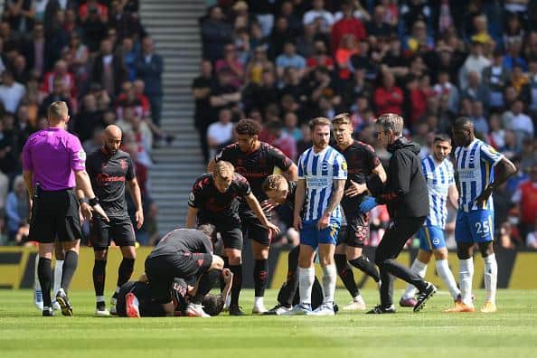 Southampton's Tino Livramento receives treatment during the 2-2 Premier League draw against Brighton at the Amex Stadium
