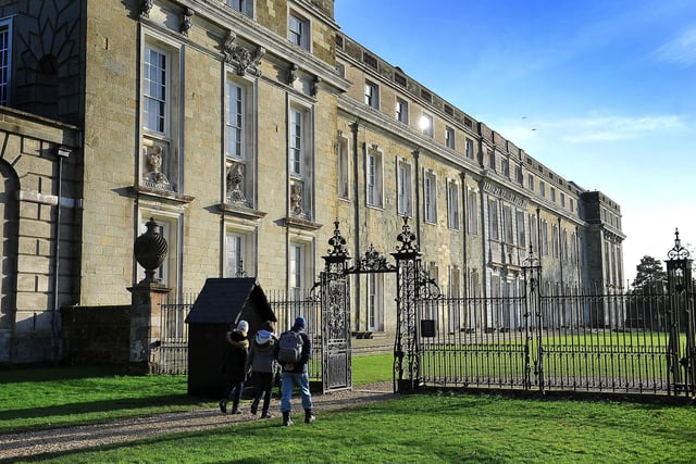 Petworth House, owned by the National Trust, is a late 17th-century Grade I listed country house and open to the public. It is located on a vast estate with a deer park.