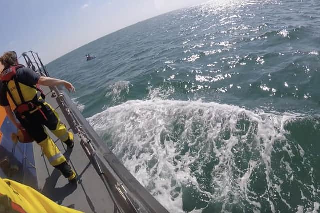 The RNLI said the casualties had capsized the board and lost their paddle, being carried offshore by the tide and strong offshore force six breeze (22-27 knots).