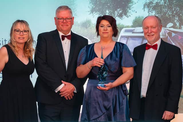 Operations Manager Michaela Rozborilova and Managing Director Simon Green receiving their award for "Campsite of the Year"
Photo: Nick Williams SUS-220427-111343001