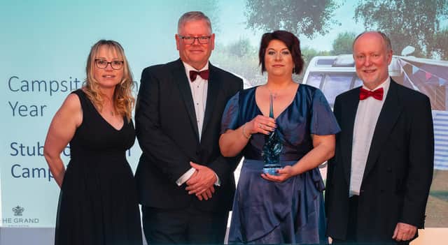 Operations Manager Michaela Rozborilova and Managing Director Simon Green receiving their award for "Campsite of the Year"

Photo: Nick Williams SUS-220427-111343001
