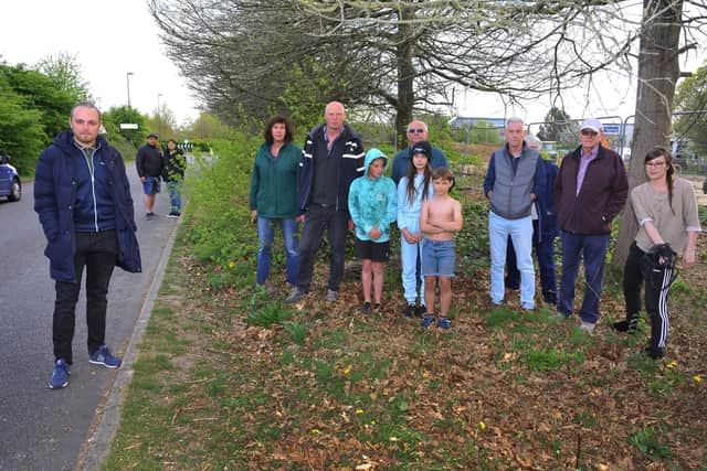 Martindales residents, pictured with councillor Billy Greening, want a safe footpath along Blakes Farm Road. Pic by S Robards