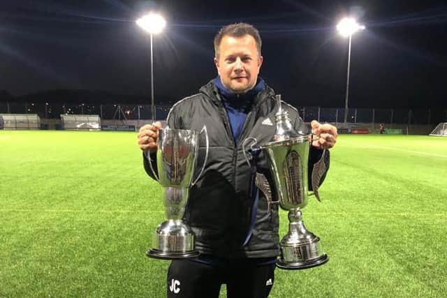 John Carey with Sidley's two trophies from a great season