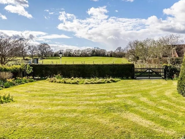 The property is surrounded by three sections of gardens. Picture: Hamptons - Haywards Heath Sales.