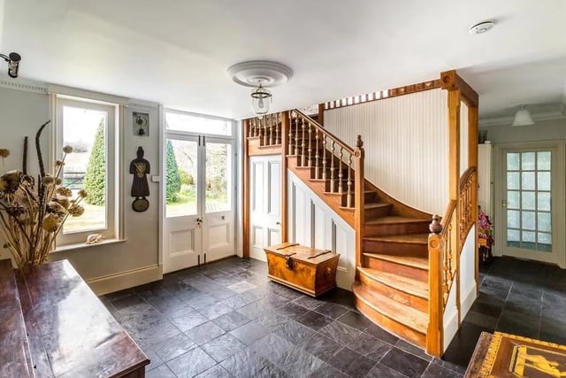 The entrance hall has slate flooring and a central main staircase. Picture: Hamptons - Haywards Heath Sales.