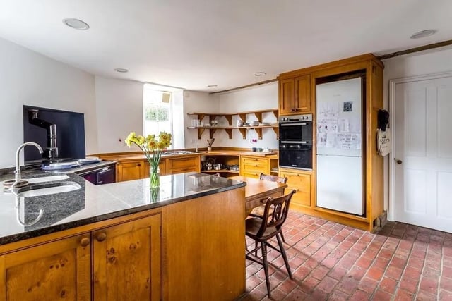 The handmade oak kitchen has a peninsular unit, granite worktops, gas aga and another gas hob. Picture: Hamptons - Haywards Heath Sales. SUS-220429-151346001