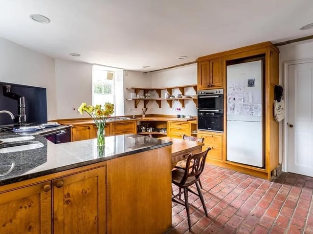 The handmade oak kitchen has a peninsular unit, granite worktops, gas aga and another gas hob. Picture: Hamptons - Haywards Heath Sales. SUS-220429-151346001