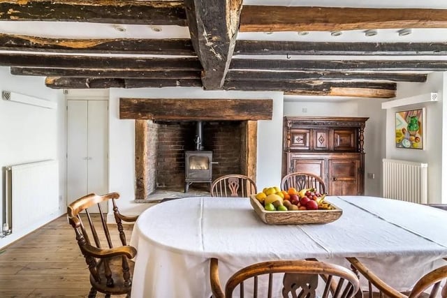 The kitchen leads through to a large dining room with an inglenook fireplace and a log burning stove. Picture: Hamptons - Haywards Heath Sales.