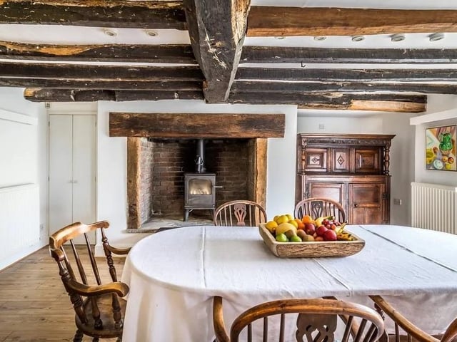 The kitchen leads through to a large dining room with an inglenook fireplace and a log burning stove. Picture: Hamptons - Haywards Heath Sales.