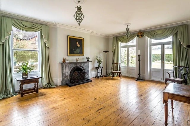 The drawing and reception rooms have high ceilings and marble fireplaces. Picture: Hamptons - Haywards Heath Sales.