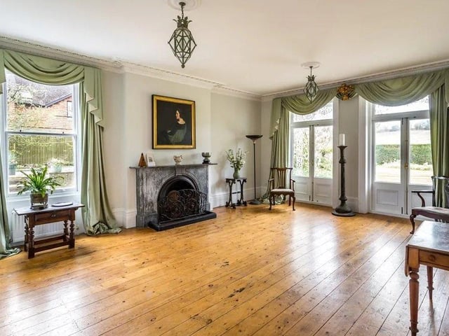 The drawing and reception rooms have high ceilings and marble fireplaces. Picture: Hamptons - Haywards Heath Sales.