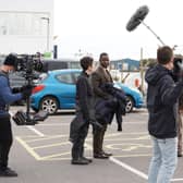 BRIGHTON, ENGLAND - NOVEMBER 04: Actor Richie Campbell films a scene as Camilla, Duchess of Cornwall visits the set of ITV's adaptation of the Roy Grace Series by Peter James on November 4, 2021 in Brighton, England. (Photo by Gareth Fuller - WPA Pool/Getty Images) SUS-220105-122151001