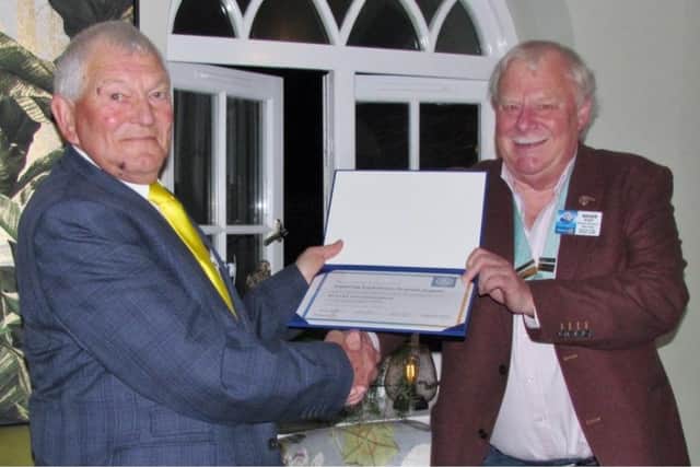 Angmering South Downs Rotary Club president Jeremy Flaskett, left, receives the charter of inauguration from district Rotary governor Roger Stent