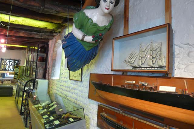 Interior of Marlipins Museum with a ship figurehead