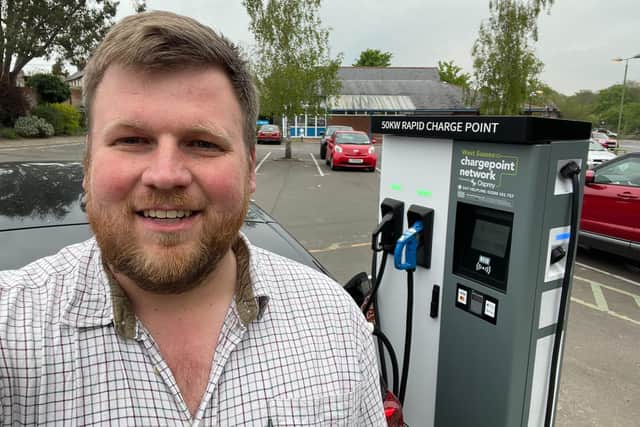 Councillor James Wright with the new rapid charge point in Storrington's library car park