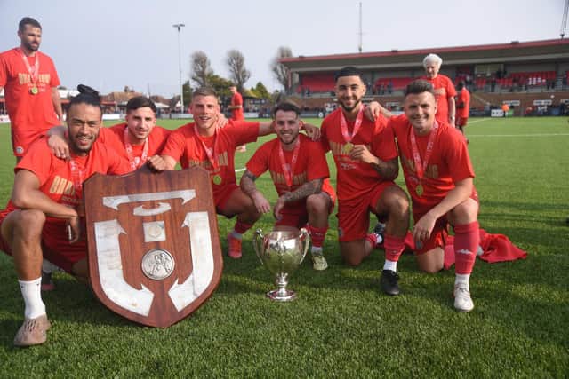 Worthing players show off the fruits of their labours / Picture: Marcus Hoare