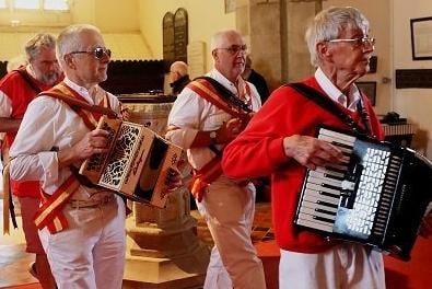 Morris musicians playing out the congegation at All Saints Church SUS-220505-104837001