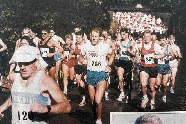 Barns Green fun run: Runners pass under the railway bridge in Two Mile Ash Road. Photo from West Sussex County Times records office