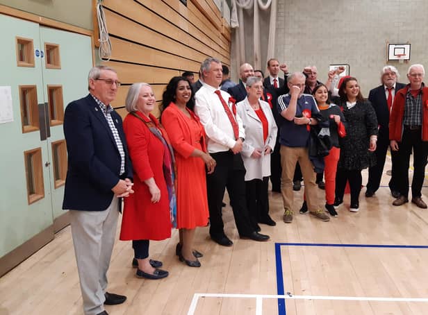 Labour members celebrate finishing on top in Crawley council election