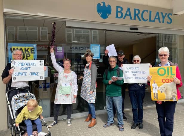 Climate activists 'clean up' Barclays bank in Worthing as part of a nationwide action against fossil fuel investment