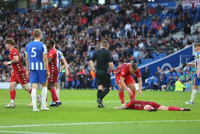 Reece Meekums is down and Worthing have a penalty / Picture: Martin Denyer