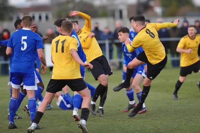 Lee Garnham strikes in the 3-3 draw with Brockenhurst - which ended in a 4-1 Golds win in the shootout / Picture: Stephen Goodger