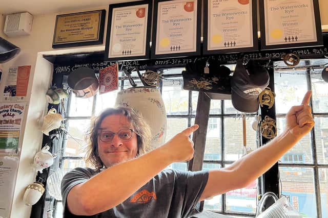 Rye Waterworks landlord David Roder with awards the pub has won. Picture by KT Bruce SUS-220518-143951001