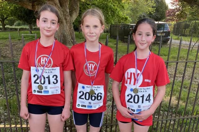 Florence Tewkesbury, Sophia Collins and Olivia Collins of HY Runners at Ashburnham
