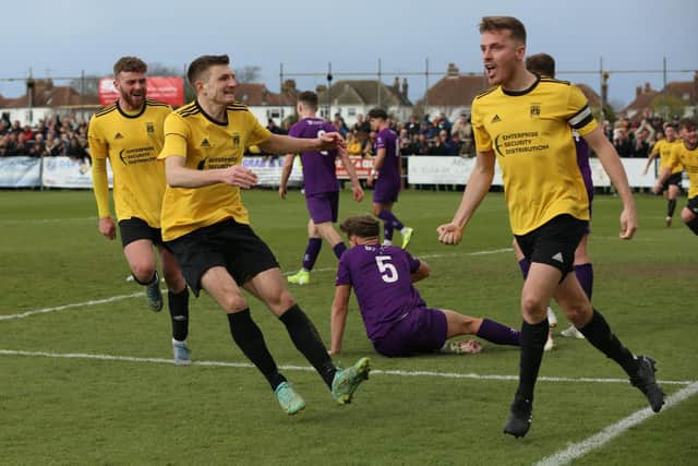Jordan Clark runs away to celebrate his headed goal in the semi-final win over Loughborough Students / Picture: Martin Denyer