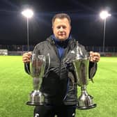 John Carey with the two trophies Sidley won in 21-22 under his management