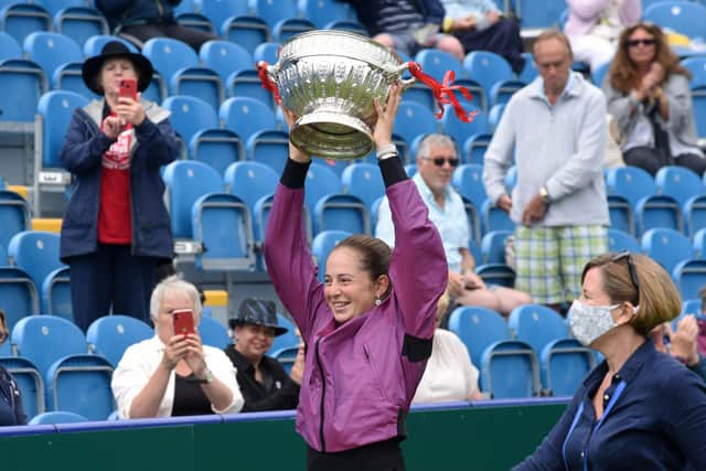 Jeļena Ostapenko lifts the women's Eastbourne trophy last year / Picture: Jon Rigby