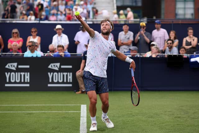 Liam Broady of Great Britain in action during his men's singles qualifying match against Hugo Gaston of France  (Photo by Charlie Crowhurst/Getty Images for LTA)