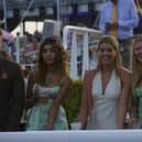 Racegoers enjoy a sunny evening at Goodwood which brought a heady mixture of racing and music / Picture: Clive Bennett