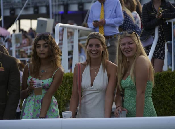 Racegoers enjoy a sunny evening at Goodwood which brought a heady mixture of racing and music / Picture: Clive Bennett