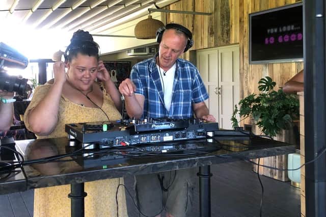 Fatboy Slim with participant Amber on the DJ decks