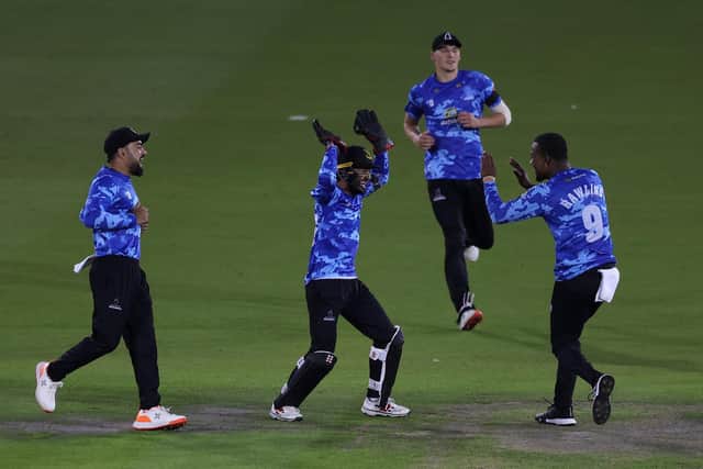 The night's two heroes - Mohammad Rizwan and Delray Rawlins - celebrate a Surrey wicket / Picture: Getty