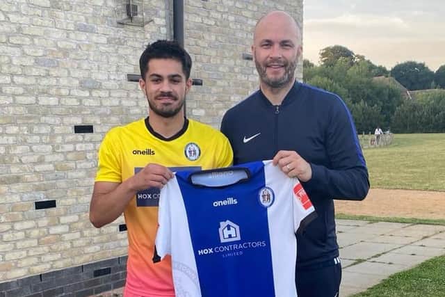 Martin Dynan welcomes Dom Pires to Haywards Heath Town / Picture: HHTFC