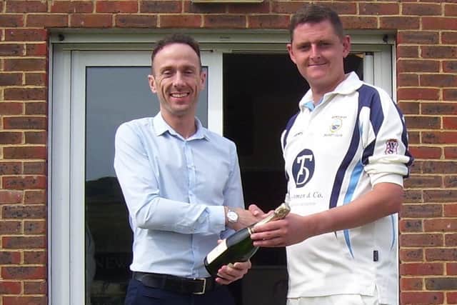 Jon Sanders from Newhaven Cricket Club's Main Sponsor, Tasker Osman & Co  Financial Accountants, presents a bottle of champagne to the Newhaven Captain Daryl Tullett