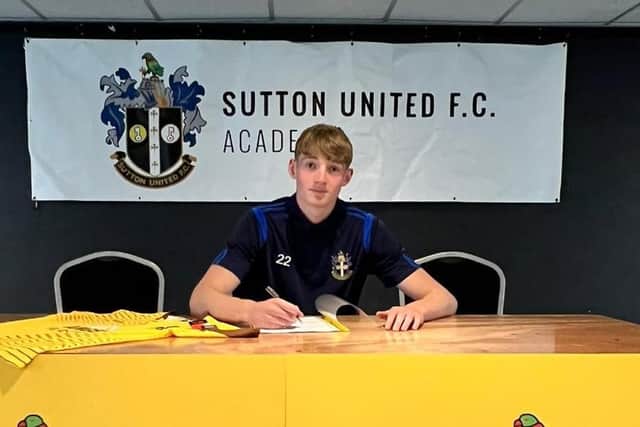 Jack Taylor signs his contract