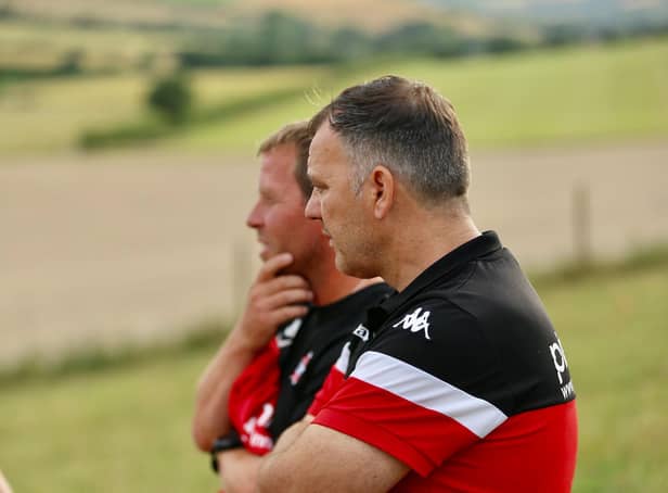 Robbie Blake and Jamie Howell look on as the Rocks train at East Dean / Picture: Martin Denyer