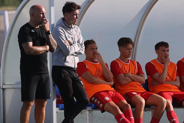 Worthing's bosses watch the action v Brighton / Picture: Mike Gunn