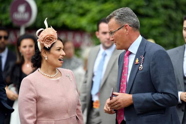 Priti Patel is welcomed to Goodwood by the venue's events MD Adam Waterworth / Picture: Malcolm Wells