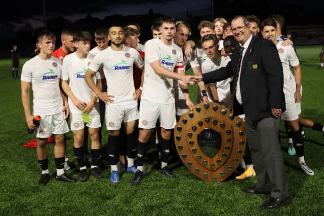 Worthing receive the Isthmian shield / Picture: Mike Gunn
