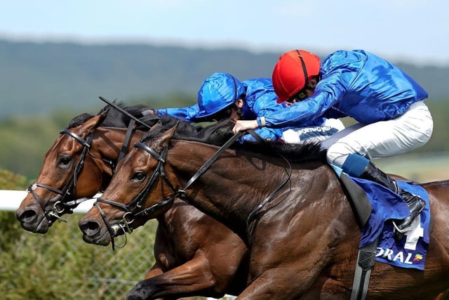 William Buick riding Warren Point (red cap) win The Coral Kincsem Handicap | Photo by Alan Crowhurst/Getty Images