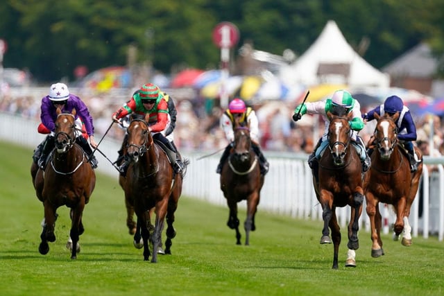 Jim Crowley riding Royal Scotsman (pink/green) win The Richmond Stakes | Photo by Alan Crowhurst/Getty Images