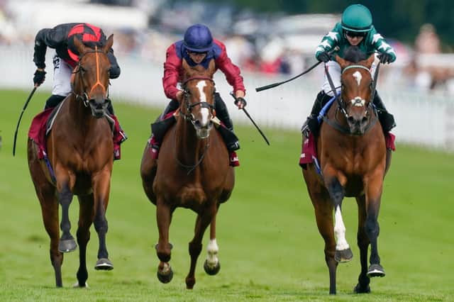Hollie Doyle on Nashwa, right of the three, wins the Nassau Stakes - the first female jockey to do so / Picture: Alan Crowhurst, Getty