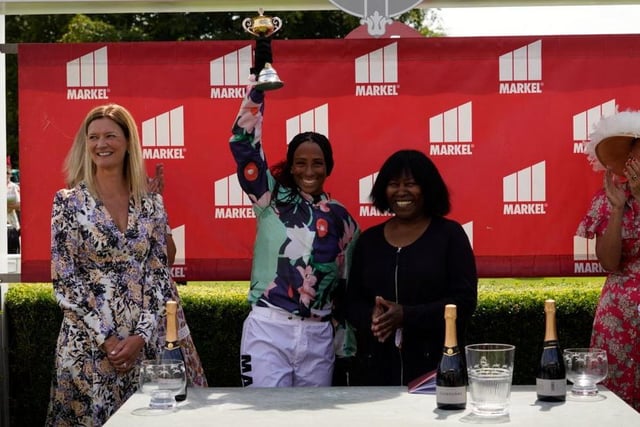 Legendary singer songwriter Joan Armatrading presents the prize to the winner of the Magnolia Cup - one of the horses in race was named after one of her songs, Show Some Emotion / Picture: Clive Bennett